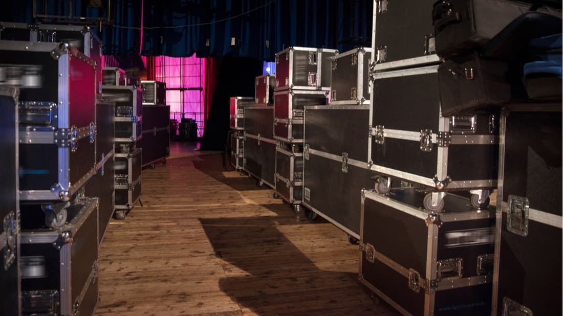 Flight cases backstage before load-in